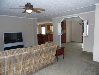LIVING ROOM TOWARD KITCHEN AND DINING VI