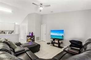 Living room featuring ceiling fan