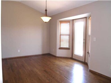 The dining features beautiful hardwood flooring an