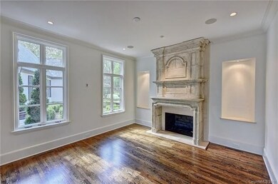 The dining room has a handsome fireplace and court