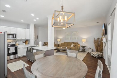 Dining room with a notable chandelier, recessed li