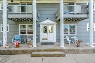 Doorway to property featuring a patio area
