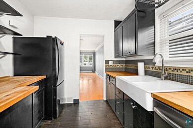 Kitchen with dishwasher, butcher block countertops