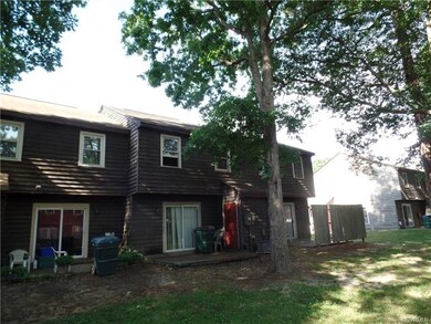 Back of Home with Attached Shed