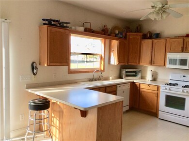 Nice, open kitchen with oak cabinets, appliances w