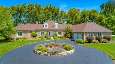 Rare solid brick home, featuring circular driveway