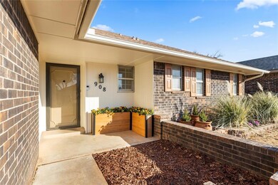 Property entrance with a patio