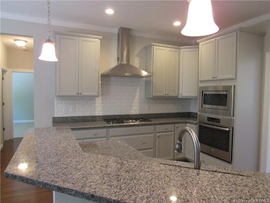 Gourmet kitchen with gas cook top, wall oven and built in microwave