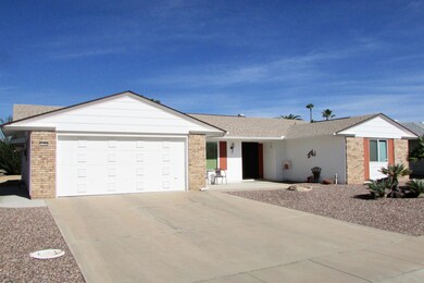 Full 2-car garage has storage cabinets