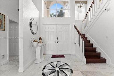Entry way with grand stairway