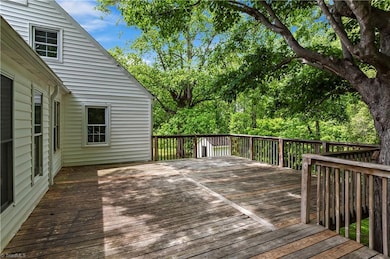 Very large deck with shade trees