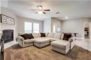 Living room featuring light tile patterned floors,