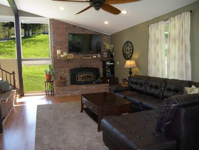 Huge great room with large windows, vaulted ceilin
