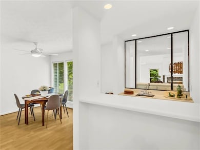 Dining room featuring wood finished floors, recess