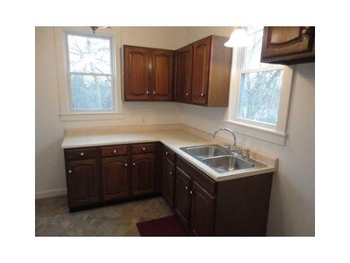 Kitchen. New wooden cabinets offer the chief plent
