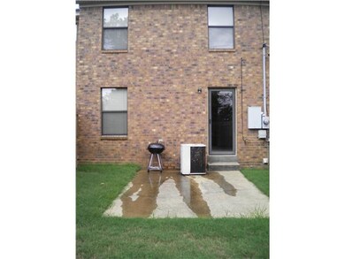 Backyard Looking at Back of Townhouse