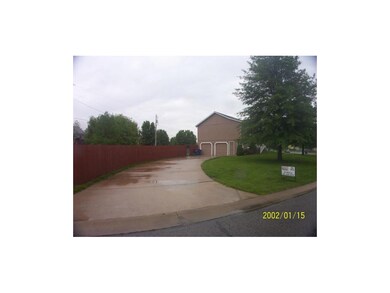 Side entry oversized garage and the yard is enclos