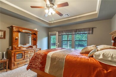 Enjoy your master bedroom with view of the many tr