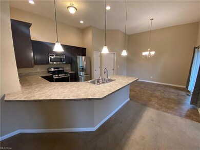Kitchen featuring sink, decorative light fixtures,