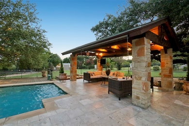 View of pool featuring a gazebo, an outdoor livin
