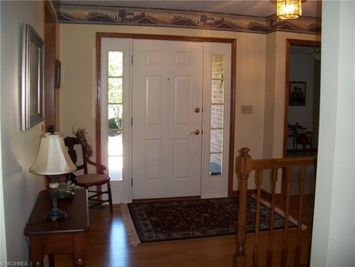 Solid wood flooring in entry greets guests