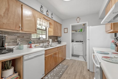 Maple Cabinetry/Stone Backsplash