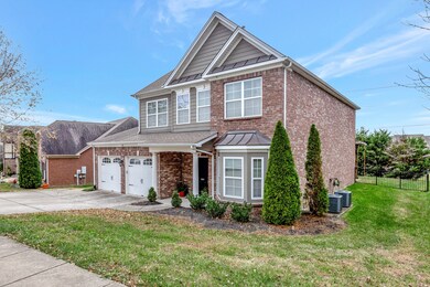 Situated on a spacious lot with mature landscaping.