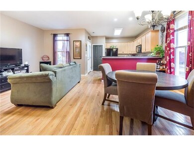 Larger great room area looking into the kitchen. A