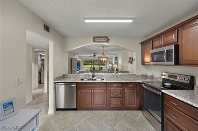 7025 Dennis Cir unit 104, Naples, FL 34104 - photo 2