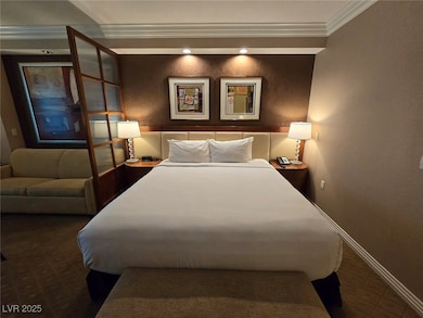 Bedroom featuring crown molding and recessed light