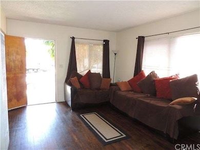 Large living room with nice flooring.