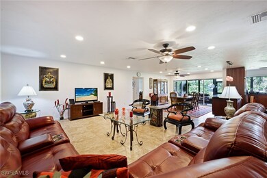 Living room with recessed lighting, a ceiling fan,