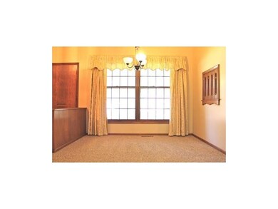Formal dining room with vaulted ceiling