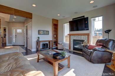 Stack rock fireplace & cherry bookcase