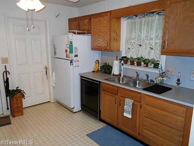 Kitchen. Laundry area off of the kitchen through this door.