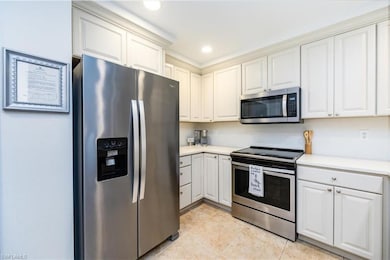 Kitchen with stainless steel appliances comes turn