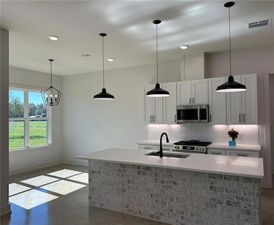 The kitchen expands to a generous breakfast room w