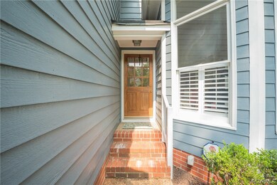 Front entrance nestled back into home