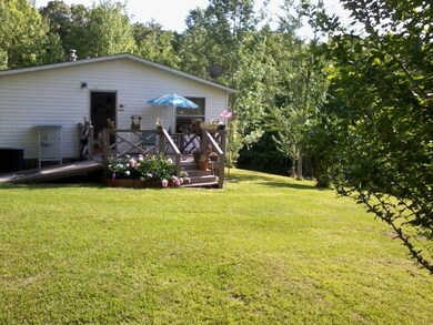 Great side porch overlooking land!