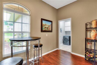 Laundry room near garage has extra tile flooring a