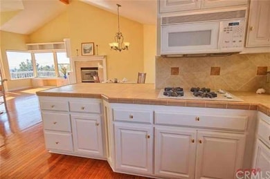White cabinets, decorative tile and ocean views fr