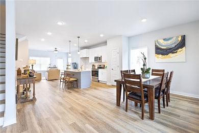 Open floor plan with LVP flooring on main level