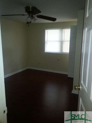 Master on Front of Home with Cherry Laminate and N