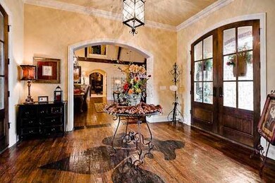 Other. Notice the hand scraped hardwood floors. Double doors mirroring each other. Outstanding finishes