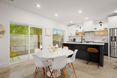 Dining room featuring finished concrete flooring,