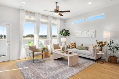 Living room with ceiling fan, recessed lighting, 