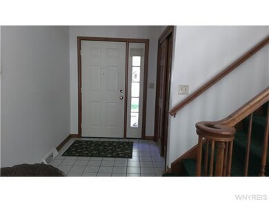 Foyer Entry foyer, closet and tile floors