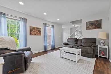 Off the entry is a sitting room with large windows