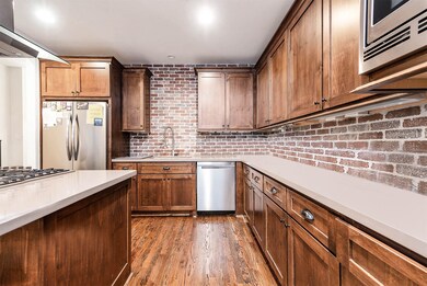 Large kitchen area. Tons of counter space and cabi