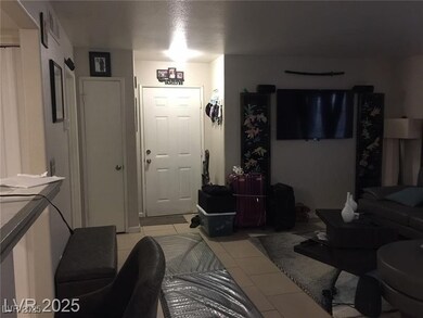 Living room featuring light tile patterned floors